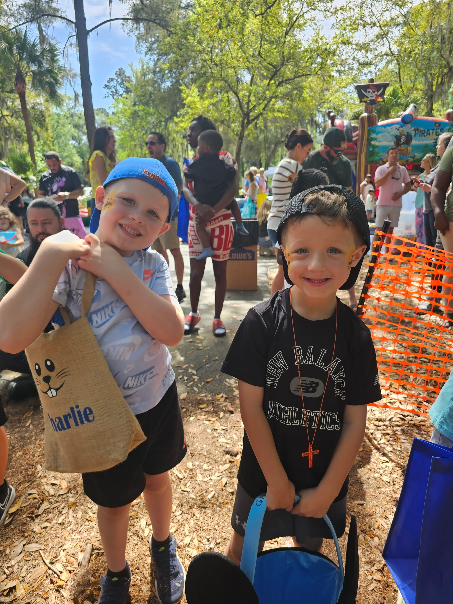 Two kids with face paint at a Central Kids Easter event