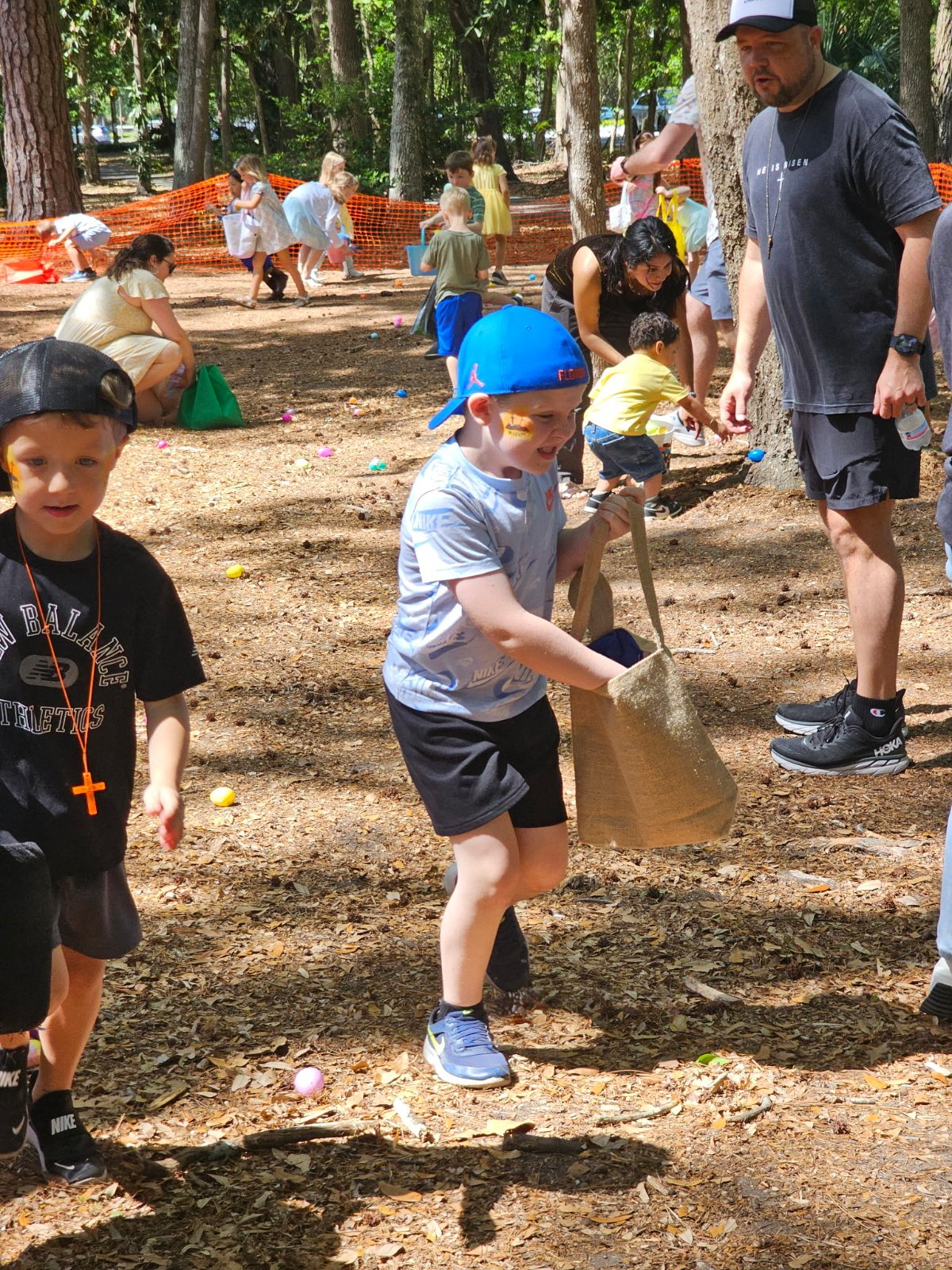 A child racing to grab eggs
