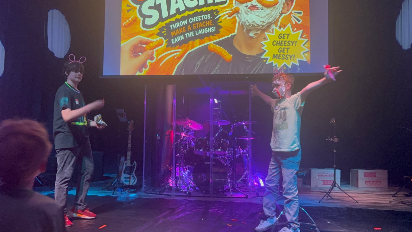 Kids worshipping on stage